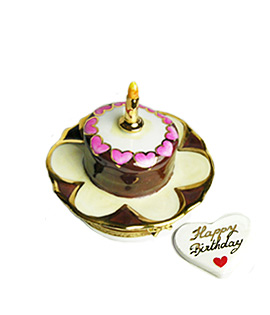small chocolate and cream Limoges box birthday cake on plate