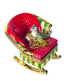 Limoges box cat in rocking chair with holiday tinsel