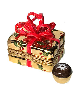 gold gift with red bow Limoges box with chocolate inside