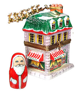 tall house with sleigh overhead and Santa figure Limoges box
