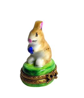 Limoges box small rabbit holding colored egg