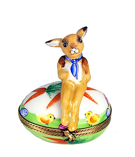Limoges box rabbit seated on decorated egg
